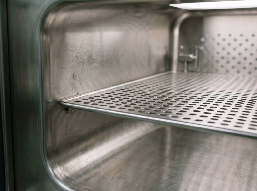 Perforated shelving inside a seamless stainless cabinet Perforated shelving inside a seamless stainless cabinet